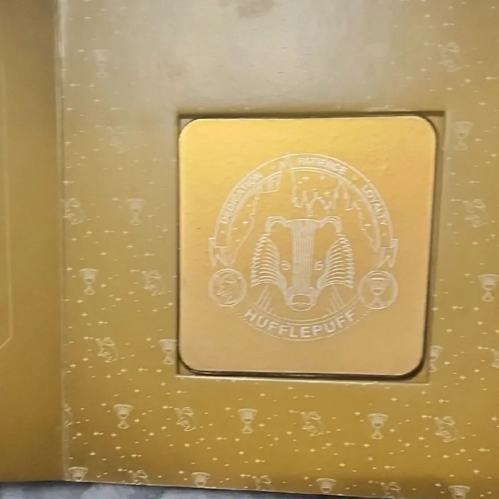 Harry Potter Hogwarts Coaster Book - Gold and Black